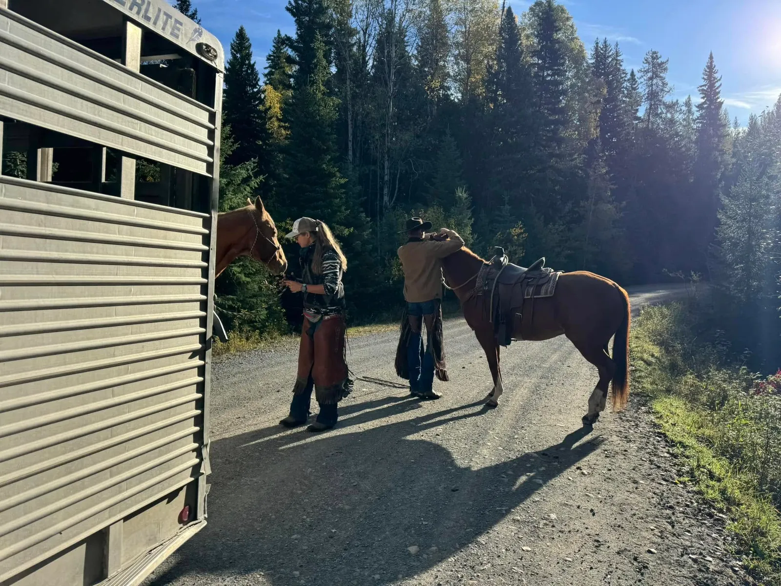 Ranch hands with horses at Purdy Ranch
